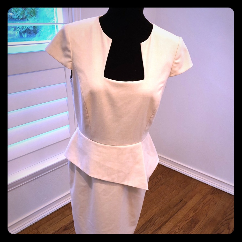 Off-white peplum dress with keyhole